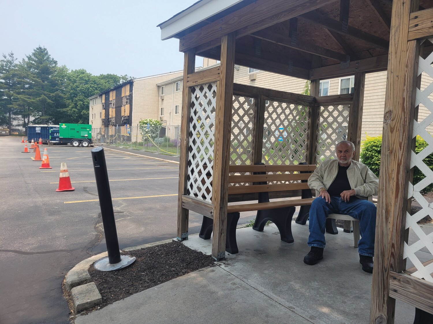 SMOKER’S HUT: Louis Furia still has his home, in a separate building. A lot of his friends are scrambling for housing, however, following the blaze at Simmons Village. He thinks the mulch surrounding all the complex buildings should be removed and replaced with crushed stone.